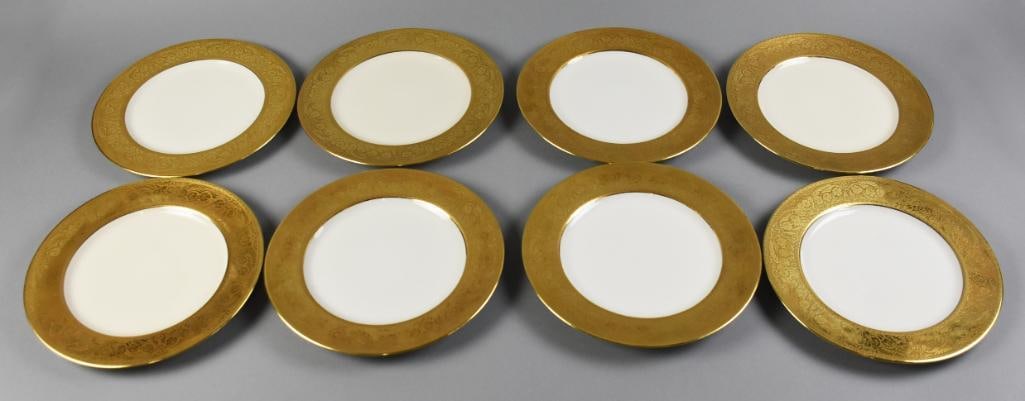 Limoges French China Plates Gold Encrusted Rim: Elegant Limoges porcelain china. Dishes are white with wide gold encrusted rims, foliate pattern. The bottom of the plates are marked Limoges France and French China in a red cartouche. Plates measure