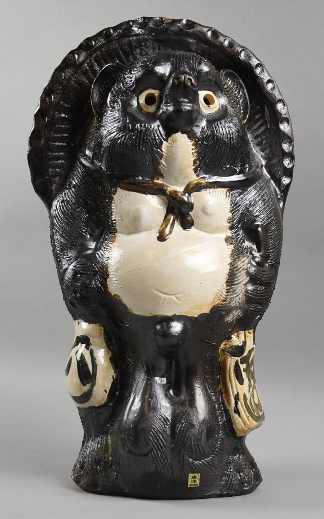 Vintage Japanese Earthenware Tanuki Sculpture: This fun piece is a Japanese Tanuki sculpture that appears to be earthenware. Retains original label and stands approx. 21" tall. This piece was in a Japanese decor shop in Little Tokyo near downtown 
