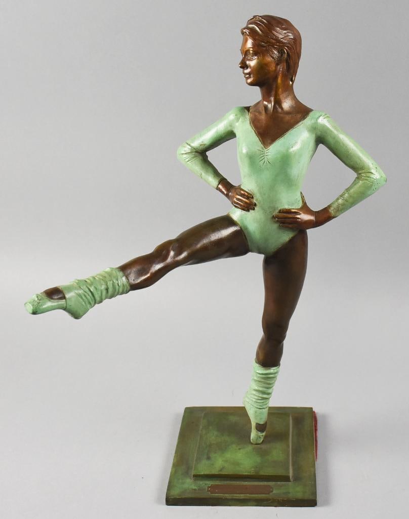 Fernando Camacho Guerrero Bronze Ballerina Statue: This is a wonderful bronze sculpture from Mexican artist Fenando Camacho Guerrero. She is a stretching ballerina balancing on her toe. The base is patinated with a bronze or patinated brass ID plate.