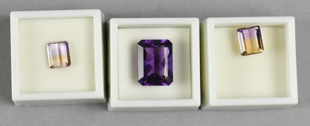 Ametrine & Amethyst Loose Stones, Faceted: Pretty loose stones that consist of an emerald cut amethyst that is 18.5 carat and two Ametrine, square cut with one being 4.70 carat and one being 6 carat.