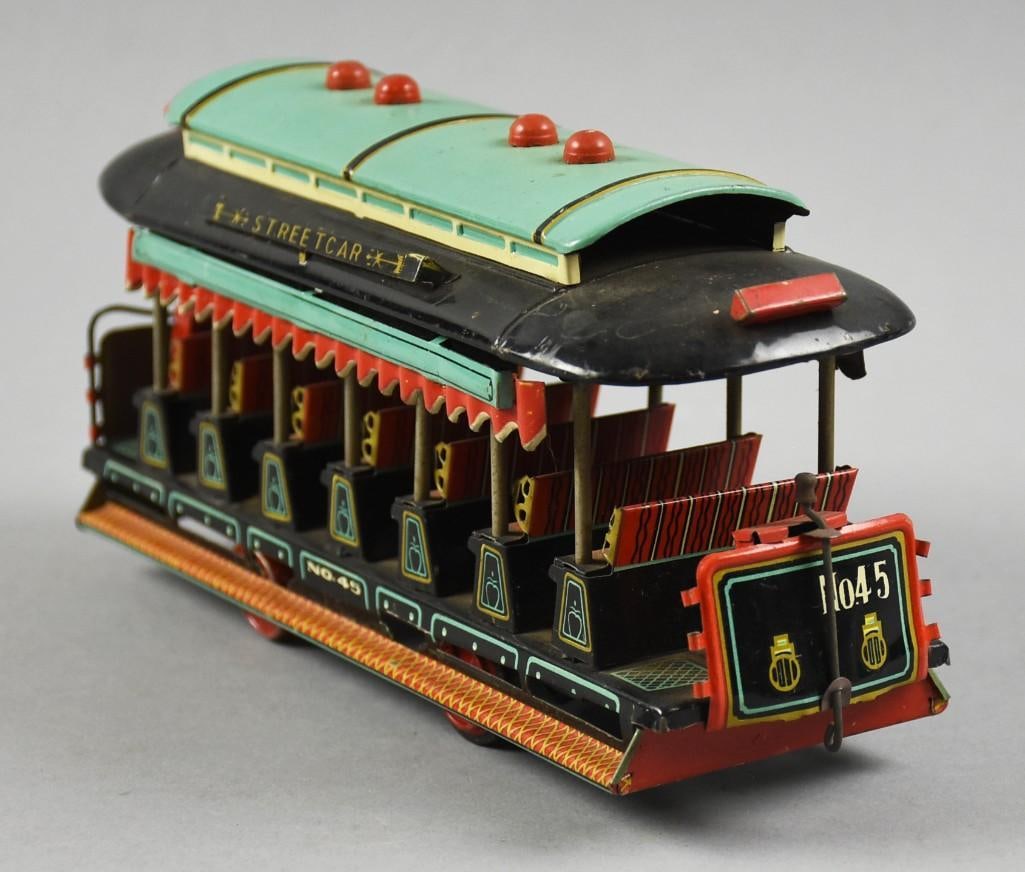 c1950 Alps Japan Tin Litho Friction Streetcar No. 45: Very cool vintage tin lithograph friction train car from Alps of Japan. It is a c1950 Streetcar No. 45, black with red and turquoise accents. Nicely marked at the back entrance. Measures approx. 5" x