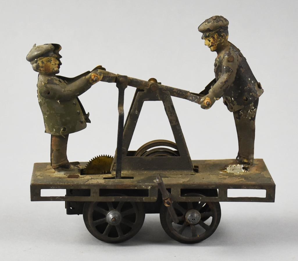 Antique Bing O Gauge Railroad Hand Car: Wonderful antique toy, attributed to Bing. It is an O gauge railroad hand car with windup clockwork mechanism. Measures approx.5" x 5" x 2".