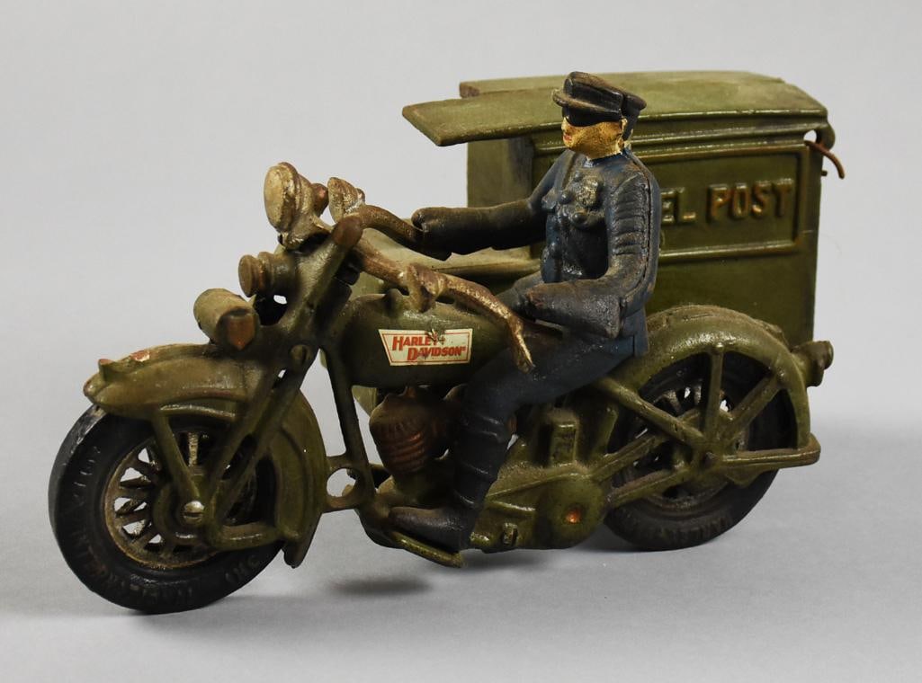 Xonex Harley Davidson Parcel Post w/ Rider Cast Iron: Nice vintage Xonex International Inc. cast iron Harley Davidson Parcel Post with rider. It is a 1997 replica of the 1928-1932 Hubley version, green painted with rider in blue suit with black hat.