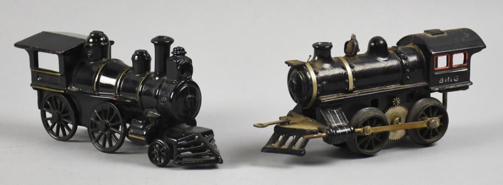 Antique Bing & Wilkins Cast Iron Locomotives: These are a pair of antique locomotives and are cast iron. You will get one Wilkins floor model that is solid black with thin gold accent stripes. Additionally, you will receive the Bing with