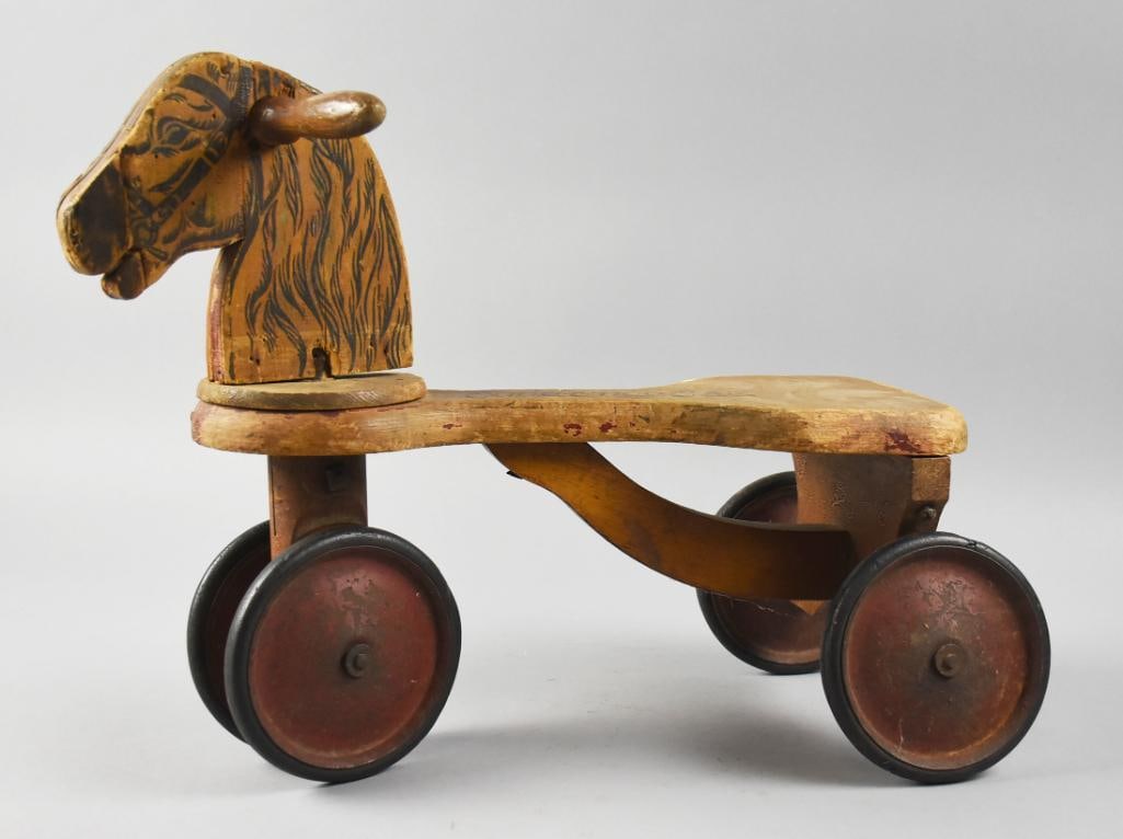 c1920 The Wilkinson Mfg Co Choo Choo Car No. 20: Darling ride on horse from The Wilkinson Mfg Co. This 1920s solid wood toy is called a Choo Choo Car. The No. 20 model has a painted face and mane, wheels appear steel with rubber. Measures approx. 14