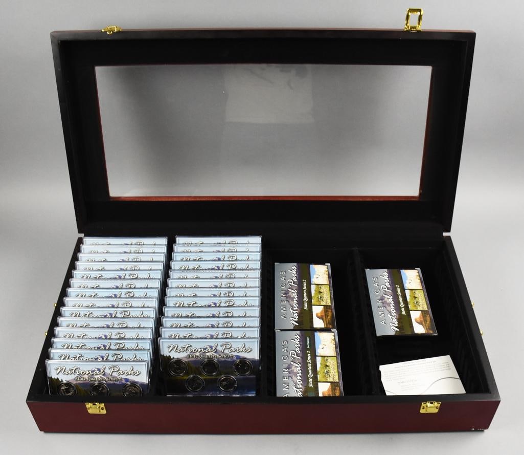 2013 National Park State Quarters-90%, Clad-In Case: Great set of National Park State Quarters from 2013. Lot with multiple cases of quarter sets. The COA indicates coins are 90% silver, nickel clad, gold clad and more. Box measures 27" x 14".
