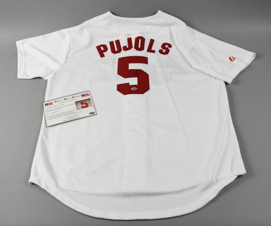 Albert Pujols Signed Baseball Jersey w/ COA Hologram Sticker: Very nice jersey signed by former St. Louis Cardinals first baseman Albert Pujols. It is an MLB official number 5 jersey and comes with a COA from Universal Sports Authority, USA hologram sticker