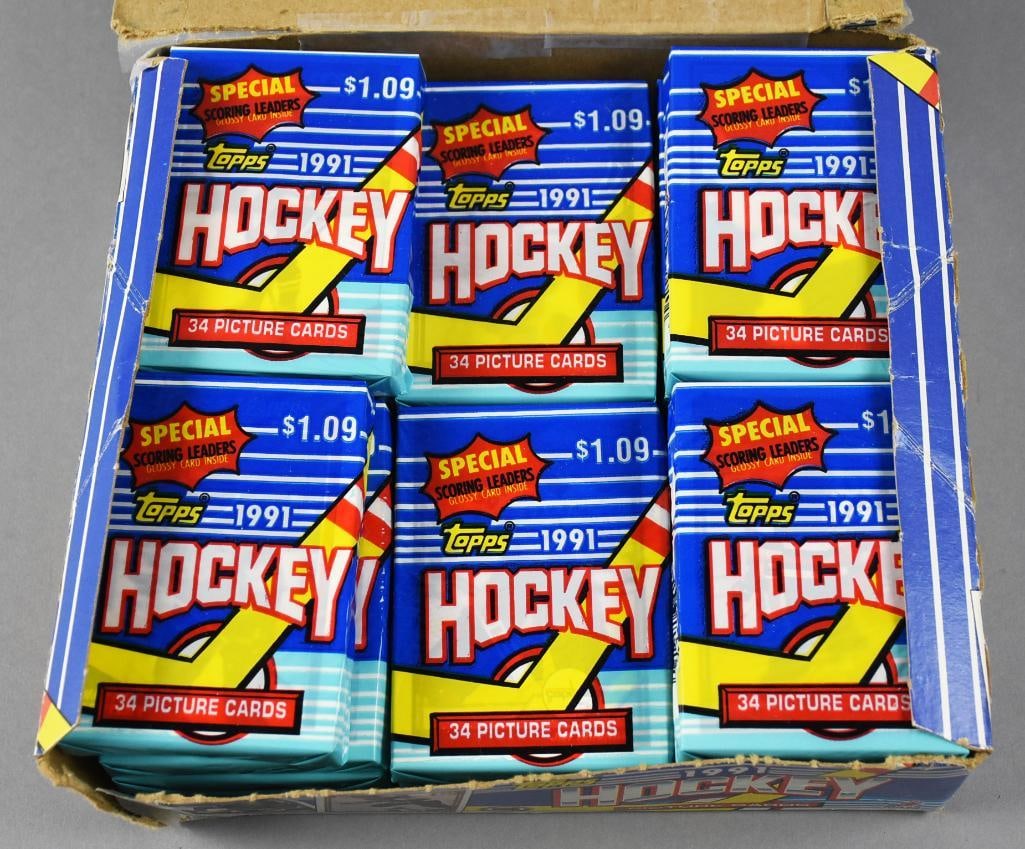 1991 Topps Hockey Picture Cards, Rookie Cards: Lot is for this nearly full box of Topps?Hockey Picture Cards from 1991. They are sealed but some packages supposedly contain a several player's rookie card. Cannot verify.