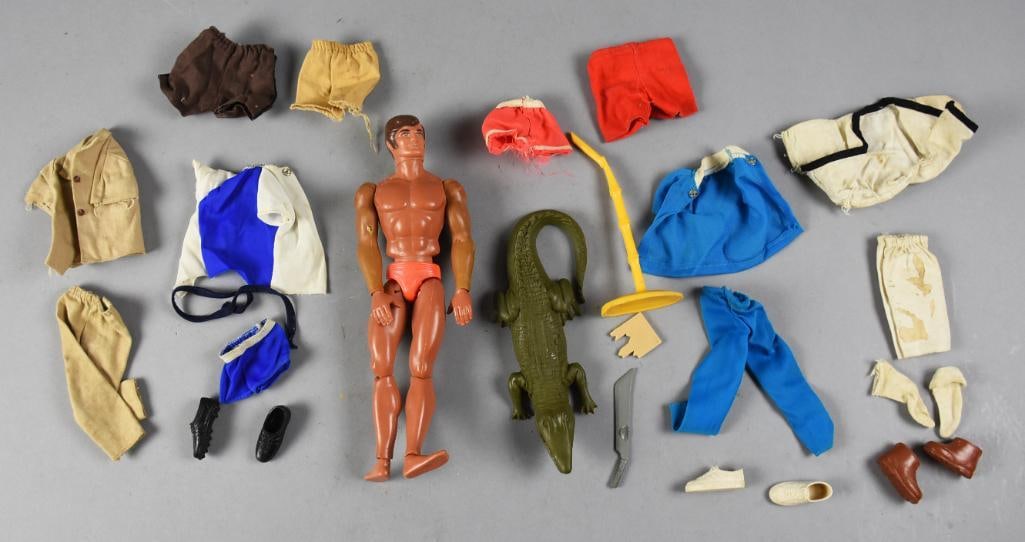 1970s Mattel Big Jim Action Figure & Accessories - Loose: Lot is for a vintage Big Jim action figure from Mattel, dated 1971. He has a push button on back activating the chopping feature. Lot includes accessories with an alligator, shorts, shoes, shirts and