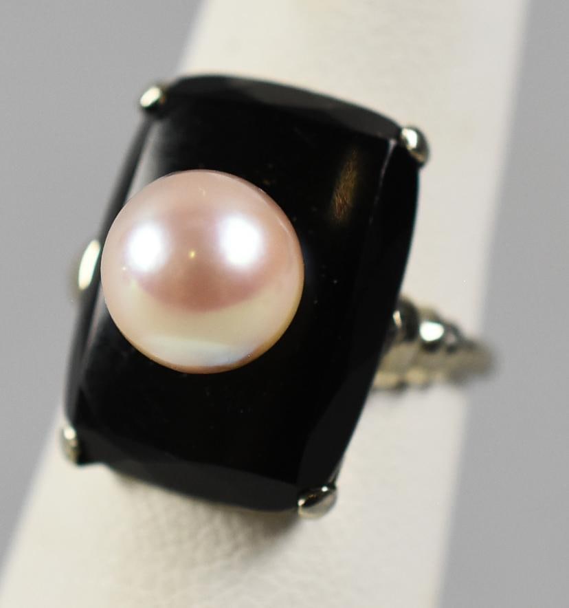 Vintage 14K White Gold, Onyx and Pearl Ring, Signed: This is a beautiful 14K gold ring. It is white gold with a four prong set rectangular onyx stone with a pearl center stone. It is stamped inside the band 14 with an Omega symbol. Size is an approx. 3 