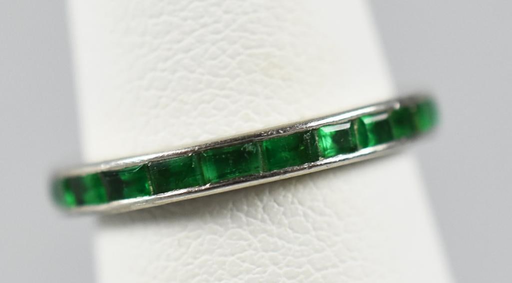 14K White Gold and Emerald Ring Band: Pretty dainty 14K white gold band with inlay of emerald cut emeralds. No visible marks and is a size approx. 4 1/2, overall approx. weight of 2.1 grams.