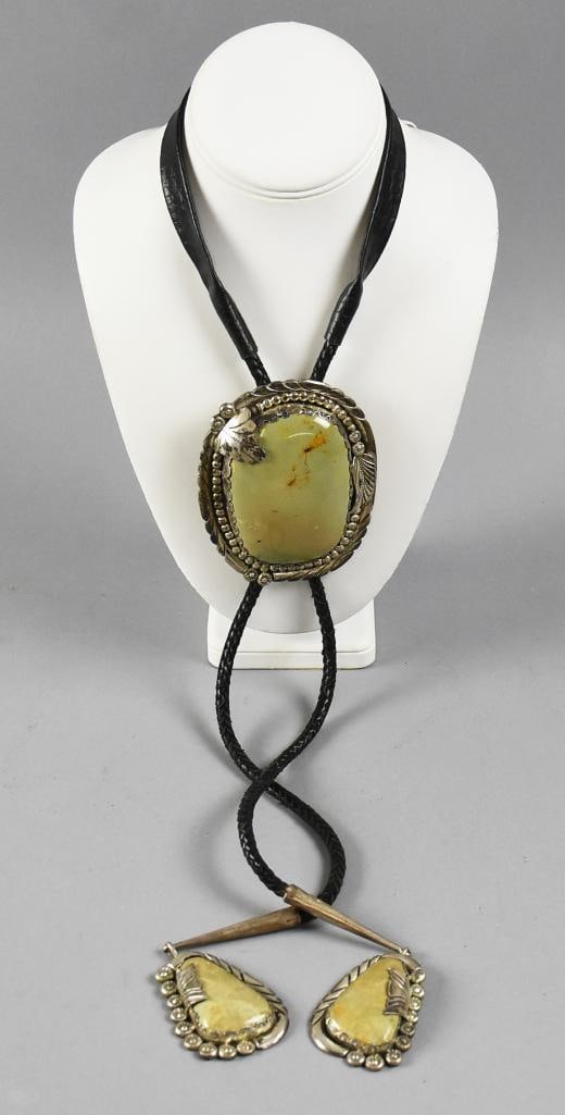 Ray Fierro Green Turquoise & Sterling Bolo Tie, Navajo: This beautiful piece is from Navajo jewelry artist Ray Fierro. Natural green turquoise set in sterling for the clasp and two dangles on the tips. All attached to a black braided leather rope. Dangles 