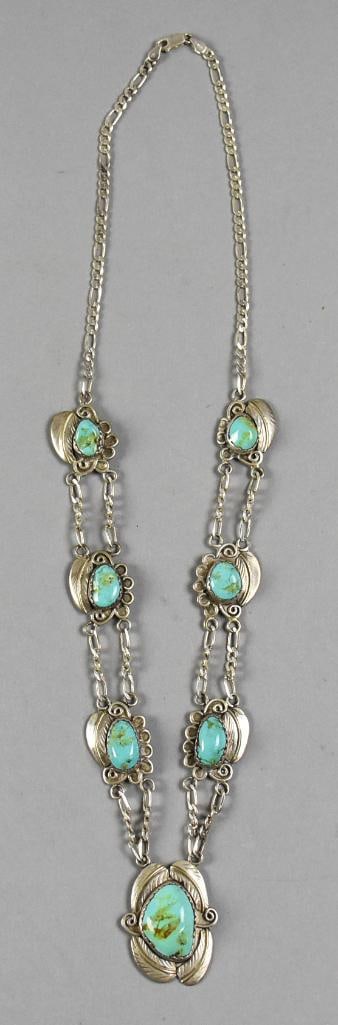 Vintage Native American Sterling Turquoise Necklace: This is a beautiful sterling and turquoise necklace. This Native American piece has seven turquoise links with feather accents and are attached to a figaro chain. Stamped on back of pendant STERLING.