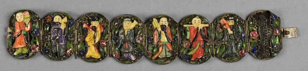 Chinese Immortals Filigree and Enamel Bracelet: Beautiful vintage Chinese import bracelet. It is oval link filigree with enamels of the seven of the eight Immortals. It is stamped CHINA and is approx. 7" long, 1.5" wide. Silver over copper