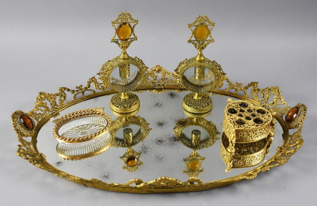 Vintage Stylebuilt Vanity Tray Set, Perfume Bottles Plus: This gorgeous piece is a vintage Stylebuilt?vanity set. This set is gilded brass with cherub, ribbon and floral details and includes a mirror tray with amber glass stone handles, two perfume bottles w