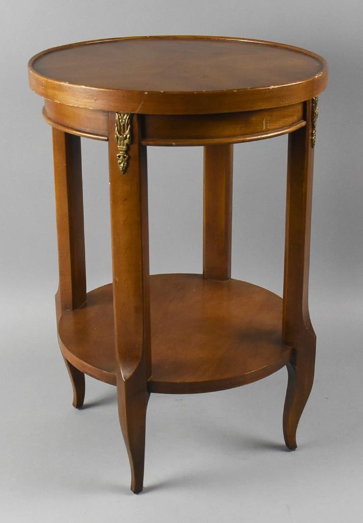 Vintage Brandt Louis XV Walnut Accent Table: This is a lovely vintage accent table in the Louis the XV style. Simple but elegant two tier, wood appears walnut with ormolu accents under table top. Retains the original Brandt label on bottom with 