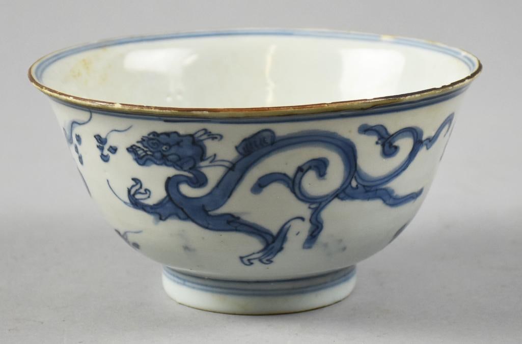 c1900 Qing Dynasty Blue and White Porcelain Cup, Signed: This darling piece appears to be from the late Qing Dynasty period. Porcelain bowl is hand painted with dragon appears to be chasing clouds with subtle gold gilt rim. Bottom appears to be a flower bou