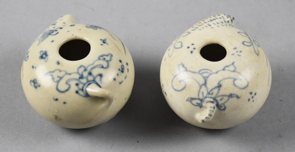 15th C Vietnamese Hoi An Hoard Blue & White Water Droppers: Amazing pair of 15th century Vietnamese porcelain pieces. They are water droppers and appear to be in the form of puffer fish. Hand painted, appears to be flowers and bees. They retain the original Bu