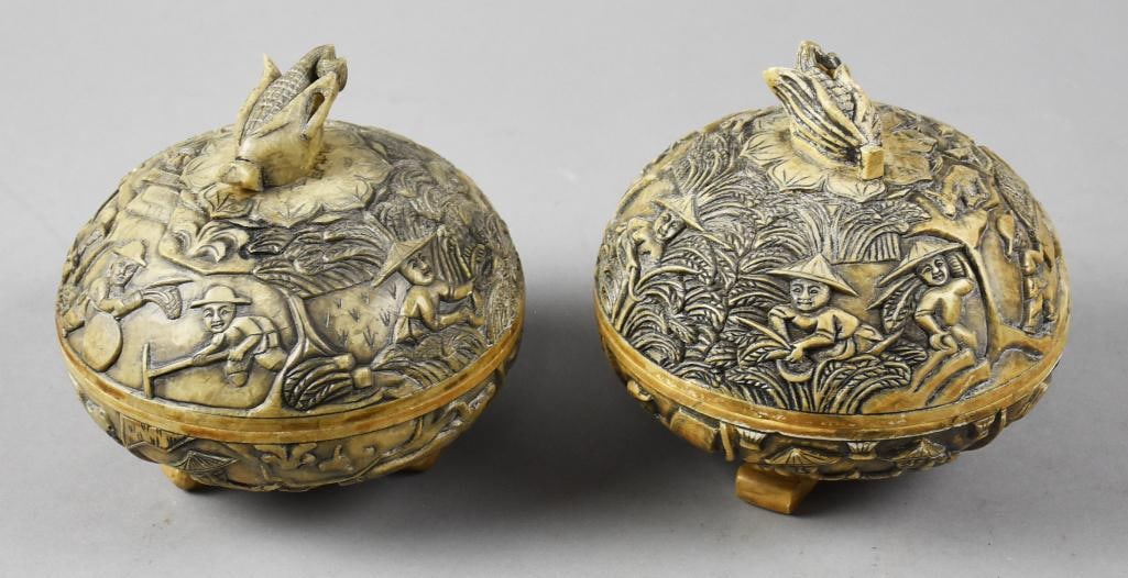 Vintage Vietnamese Soapstone Carved Trinket Boxes: These are beautiful vintage trinket boxes from Vietnam. Each appears hand carved with farming scenes and corn on the cob finials. They are marked on bottom with possibly the factory or designer mark. 