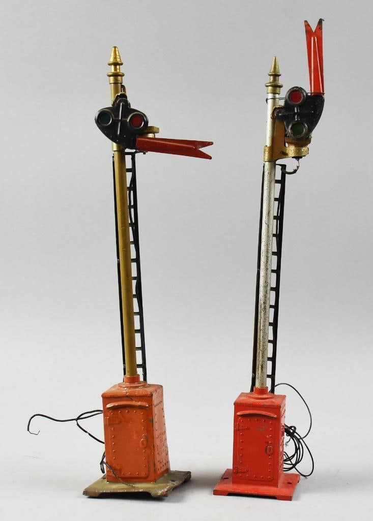 Pre-War Lionel No. 80 Semaphore Pair: Lot is for a pair of pre-war semaphores from Lionel. One is No. 80, the other shows no visible number. Both are embossed with the Lionel information. Each stands approx. 16" tall.