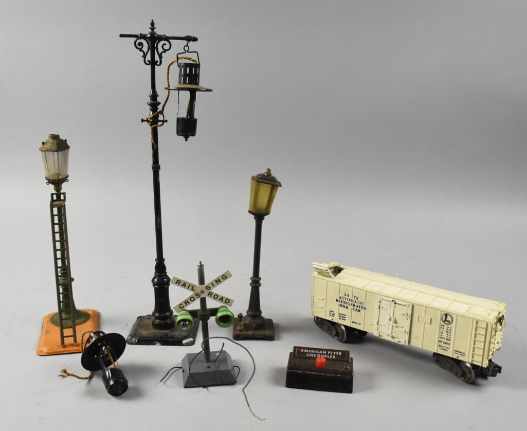 Antique Lionel & Bing Railroad Layout Accessories: This lot is for a fun assortment of antique railroad layout accessories. Includes a Bing lamp post with ladder, Lionel lamp posts, crossing sign and more.?