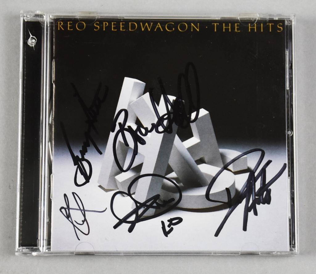 REO Speedwagon Band Signed The Hits CD - Sealed: This great CD was signed by rock and pop rock band REO Speedwagon. Members include Bruce Hall, Neal Doughty, Dave Amato, Brian Hitt and what appears to be Kevin Cronin. The CD is called The Hits and