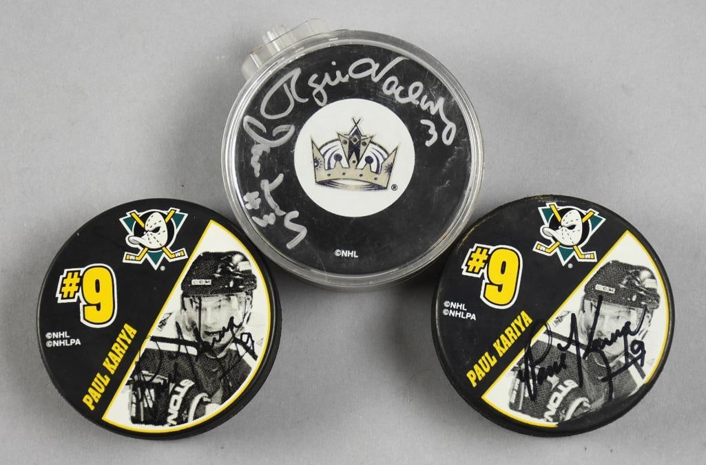 NHL Professional Hockey Player Signed Pucks: This is a cool lot for three hockey pucks. Includes one signed by Rogie Vachon and Ian Turnbull of the LA Kings and two signed by Paul Kariya and Teemu Selanne for the Anaheim Ducks.