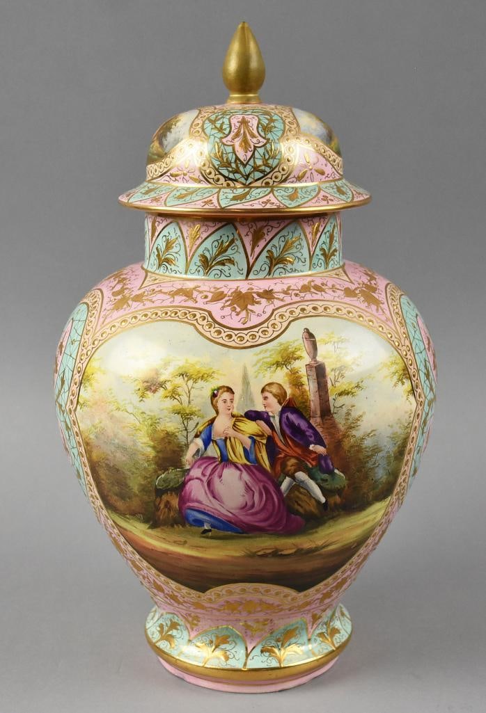 Helena Wolfsohn Dresden Porcelain Painted Covered Urn: Absolutely stunning porcelain urn is believed to be a Helen Wolfsohn, Dresden. All hand painted courting scene in a front medallion panel, pink and pale blue ground and heavy gold gilt. The lid and ba