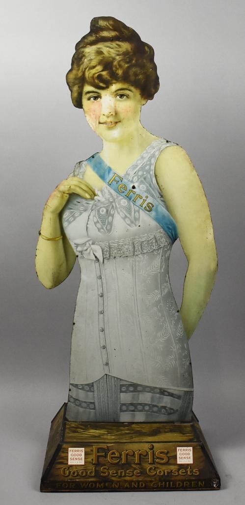 c1915 Ferris Corsets Double Sided Tin Litho Countertop Display: This wonderful and Very Rare antique is an advertisement for Ferris Corsets, founded in the late 19th century. Stylish lady is double sided with solid corset with lace and a bow with shoulder sash adv