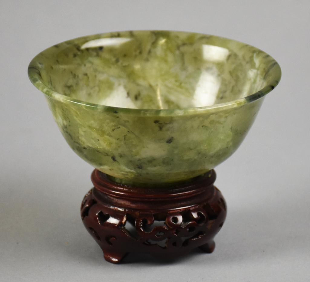 19th Century Chinese Spinach Jade Bowl w/ Stand: This is a wonderful antique bowl from China. It is spinach jade from the 19th century. Comes with it's own custom stand. Measures approx. 3" x 4". From the estate of a collector of excellent and