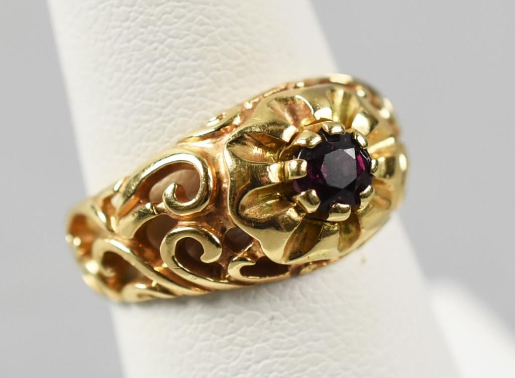 14K Yellow Gold, Ruby Ring: Stunning vintage 14k yellow gold ring with prong set ruby. It is a stylized flower with open scroll work along band sides. It is stamped inside under the flower STULLER and stamped 14K. Overall approx