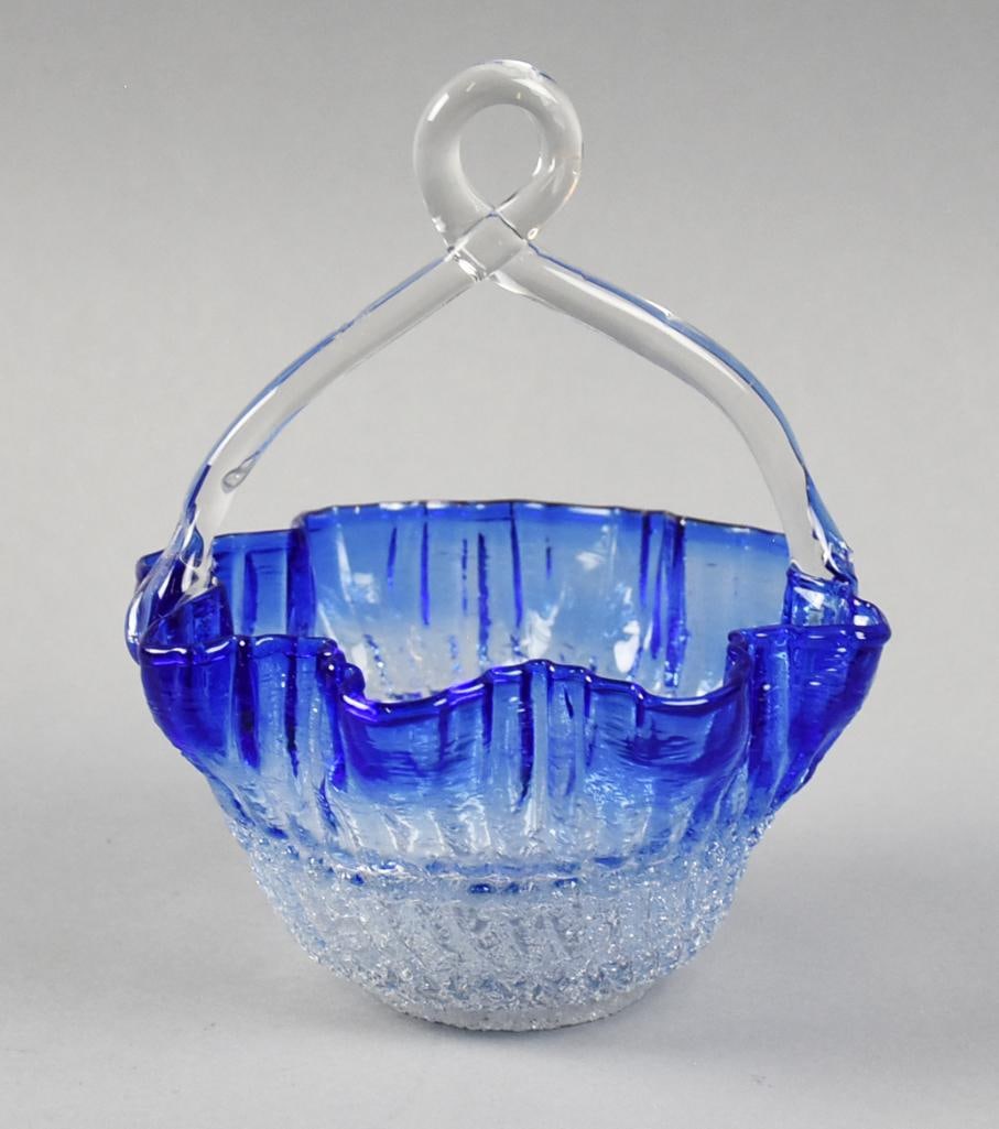 Antique Cobalt to Clear Free Form Bride's Basket: This beautiful basket is antique. It appears to be?free form blown cobalt to clear glass with twist handle. No visible marks and measures approx. 6" x 5". Late 19th-century Victorian art glass basket