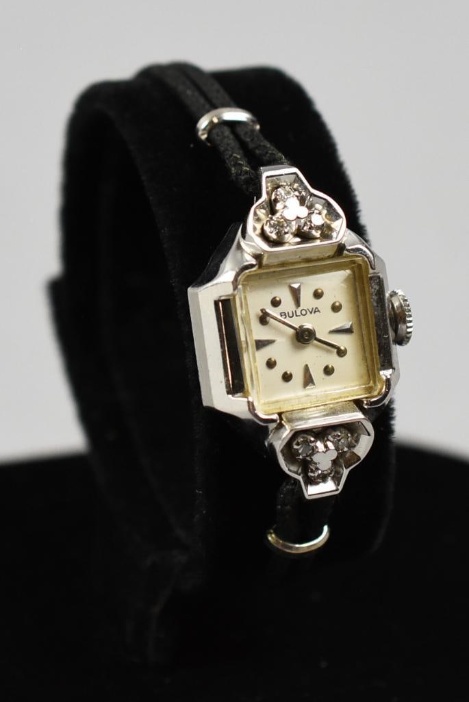 14K Bulova Ladies Watch White Gold: This is a gorgeous Bulova ladies wrist watch with monogram to Y.C.C. Case is 14K white gold with three round cut diamonds on each side of the case. Face is marked with the manufacturer name, triangle
