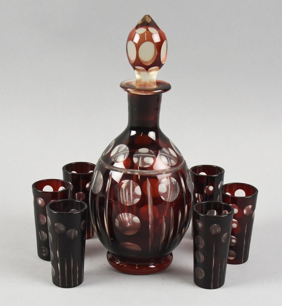 Vintage Czech Bohemian Ruby Cut to Clear Decanter, Glasses: This lovely set is Czechoslovakian crystal in ruby glass, cut to clear. Set includes a 9" tall decanter with original stopper and six 3" tall drinking glasses. No visible marks.
