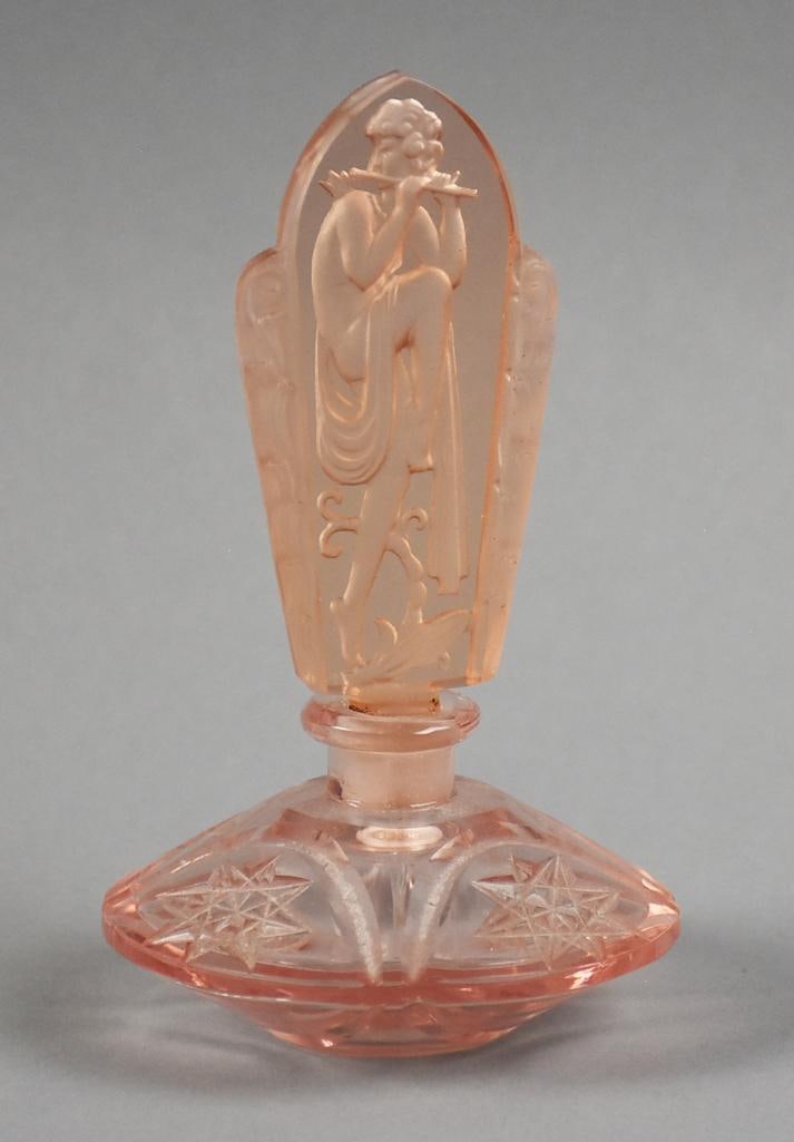 c1930 Czech Crystal Perfume w/ Leda & Swan Stopper: Wonderful 1930s Czechoslovakian cut crystal perfume bottle in pink. The stopper is Leda & Swan attributed to Henry Schlevogt and named after his daughter Ingrid. Stands approx. 5.5" tall.