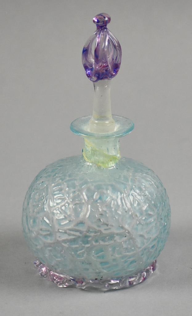 Antique Molded Crackle Perfume Bottle w/ Stopper: Here is a pretty early 20th century perfume bottle in purple and blue with subtle iridescence. It is a molded crackle pattern with applied base. Stopper is freeform. No visible marks and stands approx