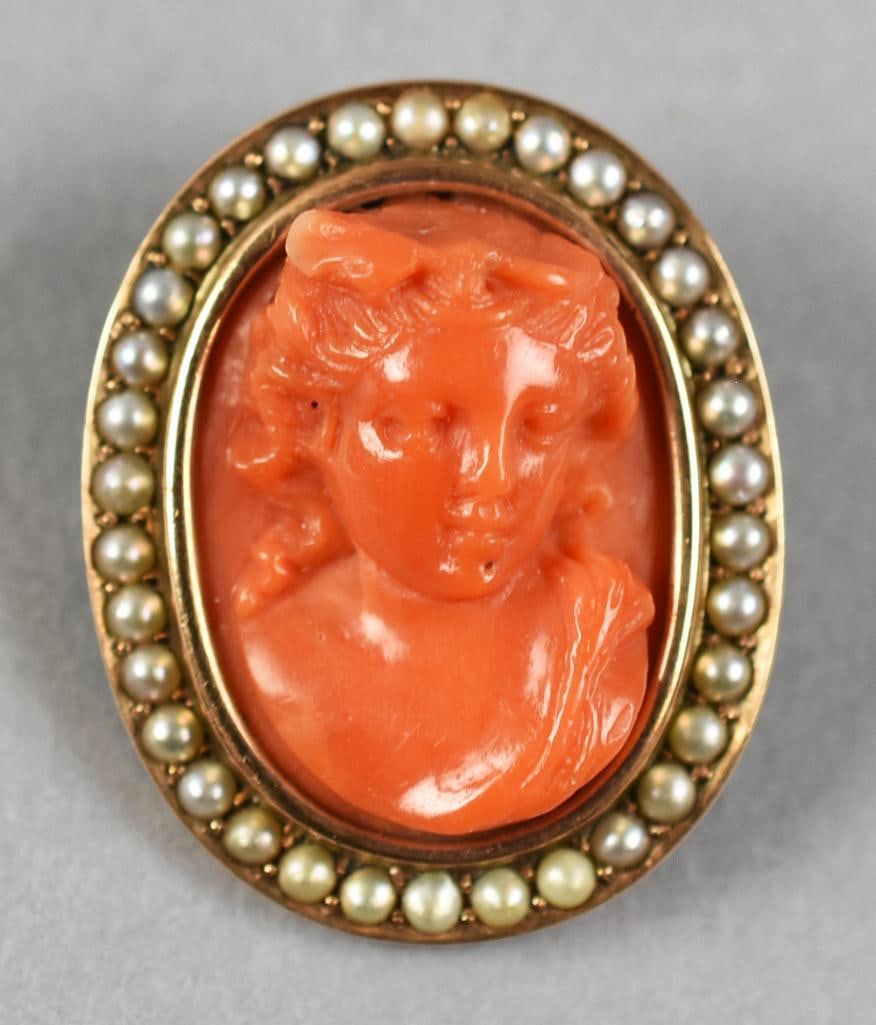 Victorian 10k Carved Cameo Brooch High Relief: Lovely Victorian hand carved antique 10k gold brooch inset with a piece of hard-carved coral surrounded with seed pearls. High carved relief on the brooch. Very nice example. Weight = 8.5g
