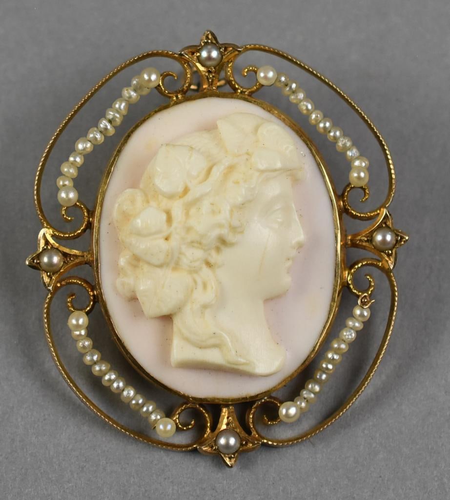 FP Scolfield Co. 10K Yellow Gold Shell Cameo, Pearls: This beautiful Victorian piece is from jewelry manufacturer F.P. Scholfield. It is a carved hard shell cameo brooch set in 10K yellow gold. The open work gold frame is accented with small pearls. It i