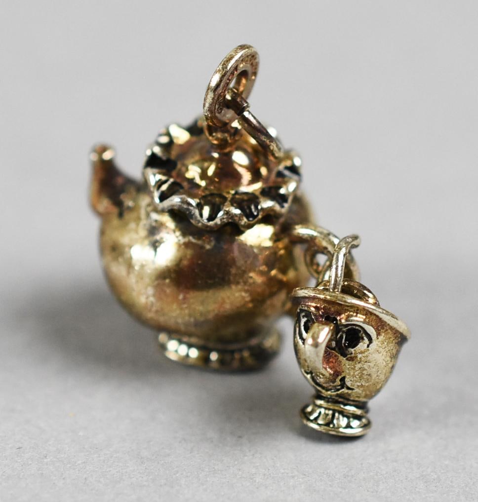 Disney Sterling Mrs. Potts & Chip Ltd Ed Charm, Original Box: Cute limited edition charm from the Disney Store. It is a Mrs. Potts & Chip from Beauty and the Beast. Comes in the original presentation box. Limited edition, came exclusive.