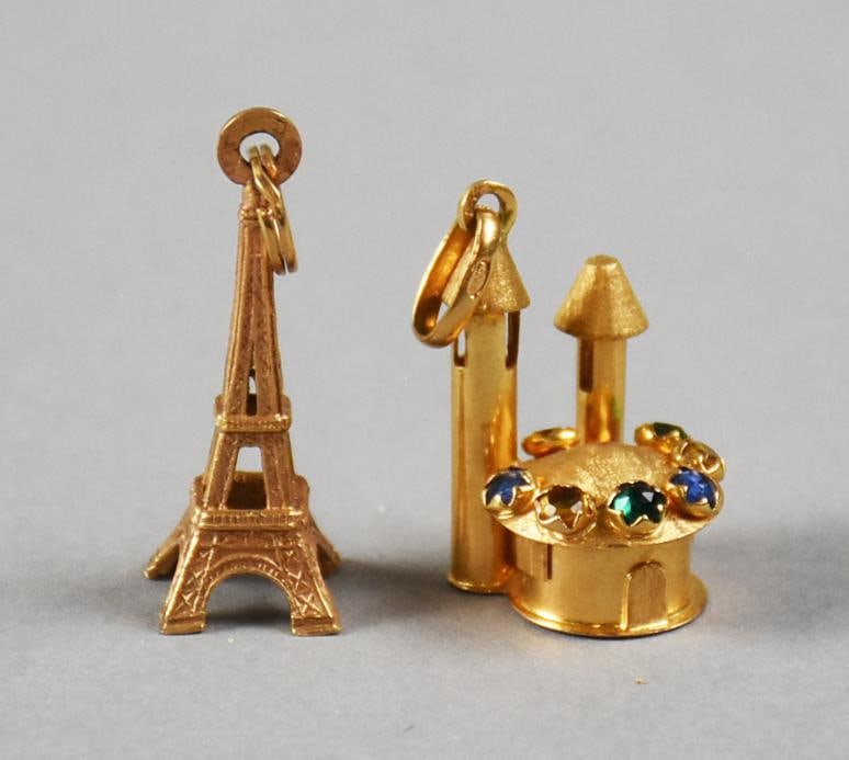 Vintage 18K Charms, Eiffel Tower and Jeweled Castle: Pretty pair of 18K yellow gold charms for your charm bracelet. Includes an Eiffel Tower and one that appears to be a castle with sapphire, emerald and citrine. Overall approx. weight of 7 grams.