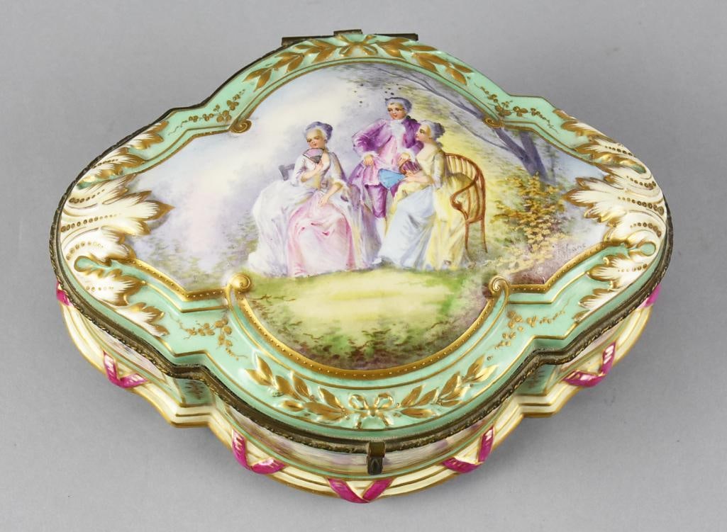 1771 Sevres Porcelain Large Hand Painted Box: Absolutely stunning piece of 18th century porcelain from the Sevres factory in France. The hand painted scene on lid is in the style of Jean-Antoine Watteau romantic scene. Ground of a mint green with