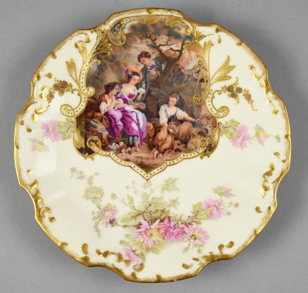 Limoges France 1900's Porcelain Hand Painted Plate: This is an absolutely gorgeous plate from Limoges. It is hand painted, medallion style with three young ladies and a young man as well as a basket of kittens and a goat. It is accented in a thick gold