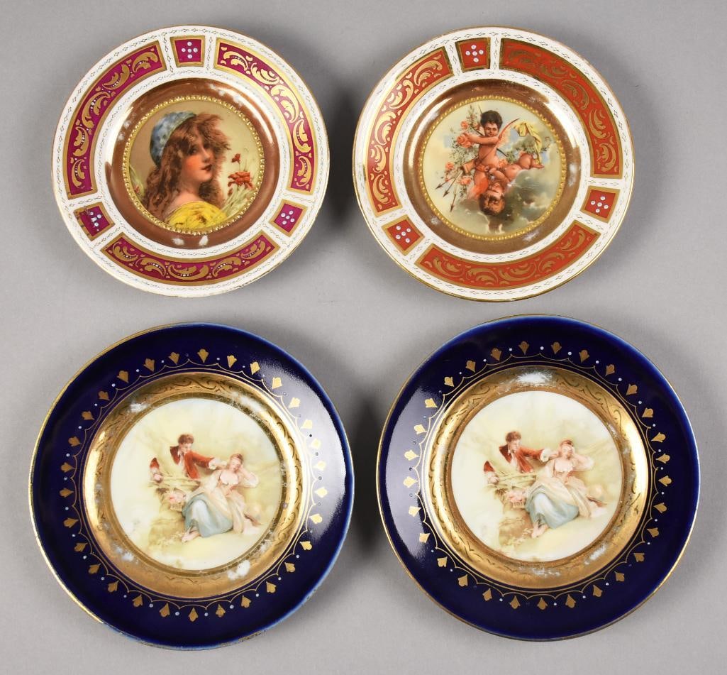 Antique Royal Vienna Porcelain Cabinet Plates: These are four different and very pretty antique Royal Vienna cabinet plates. The rust and wine plates are Art Nouveau, with one having a beautiful young woman and one with cupids. Both are approx. 5"