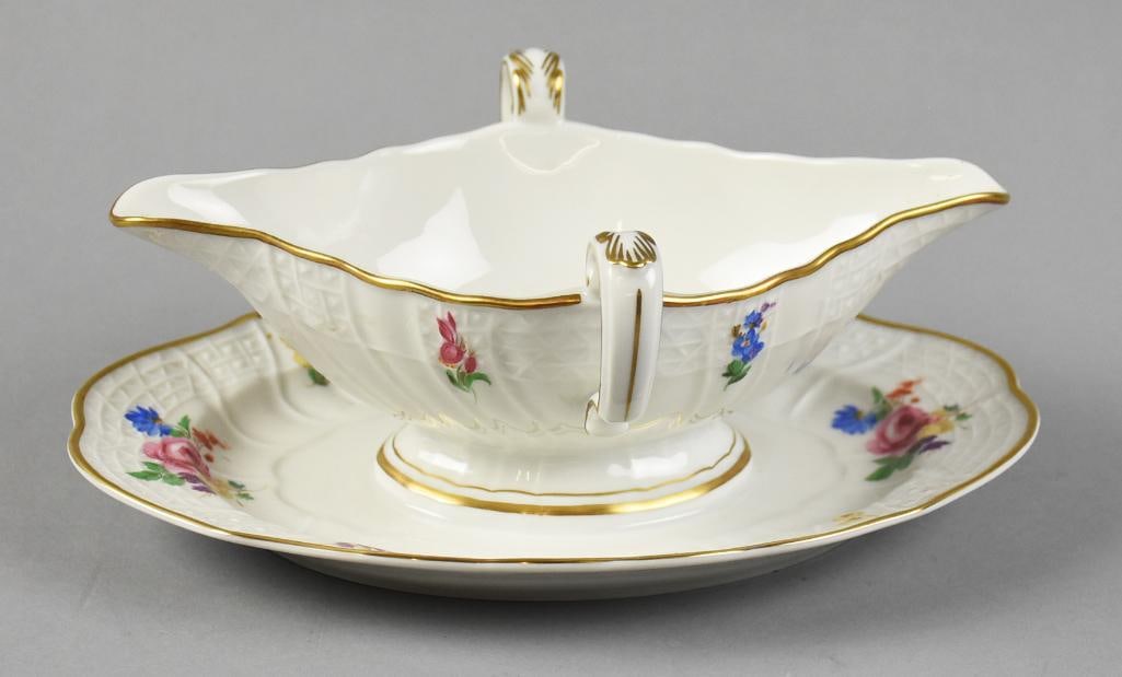 c1880 Hutschenreuther Selb Porcelain Double Handle Gravy Boat: Terrific porcelain gravy boat from Hutschenreuther?Selb. Floral design of pink and blue flowers and gold accents. Double handle and attached underplate. Nicely marked on bottom.