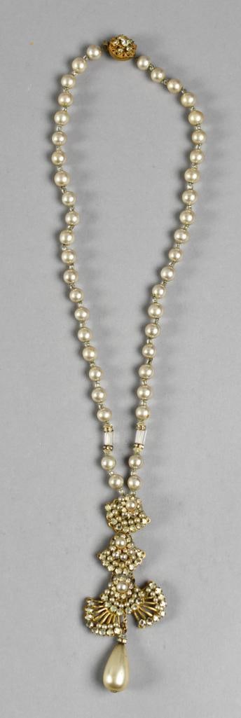 Vintage Miriam Haskell Pearl & Rhinestone Pendant Necklace: This beauty is from jewelry artist and designer Miriam Haskell. It is faux pearl and rhinestone double fan shaped drop pendant. Necklace is faux pearl with clear glass beads and rhinestone rondelles.