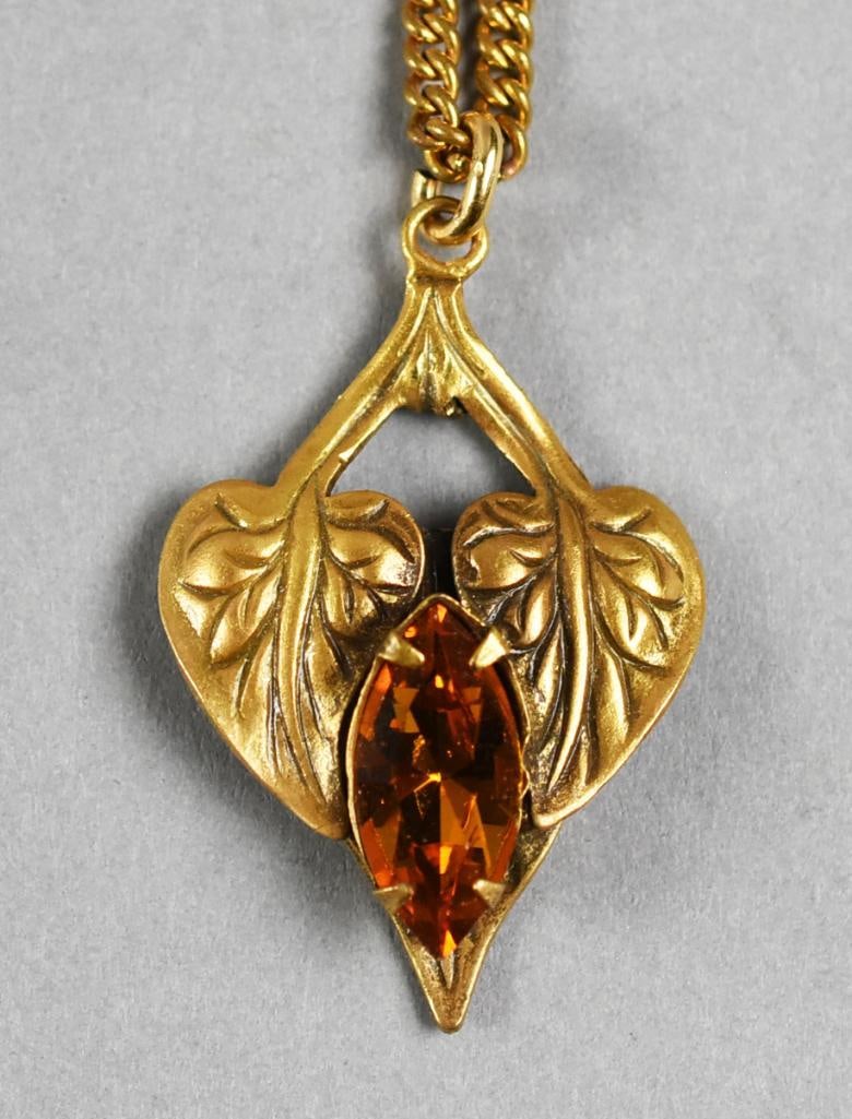 MOC Joseff of Hollywood Amber Crystal & Leaf Necklace: Gorgeous vintage necklace from Joseff of Hollywood. Pendant is leaves with an amber colored faceted crystal. All gold tone and on a gold tone chain. Comes on the original card.