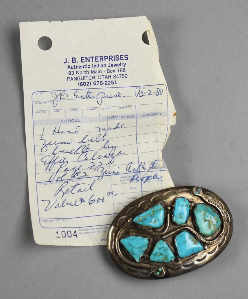 Effie Calavaza (1927-2019) Zuni Sterling Turquoise Belt: This wonderful piece is from Zuni jewelry artist Effie Calavaza (1927-2019). Belt buckle of sterling, winding rattlesnakes with polished turquoise. Signed on the back by the artist. According to the