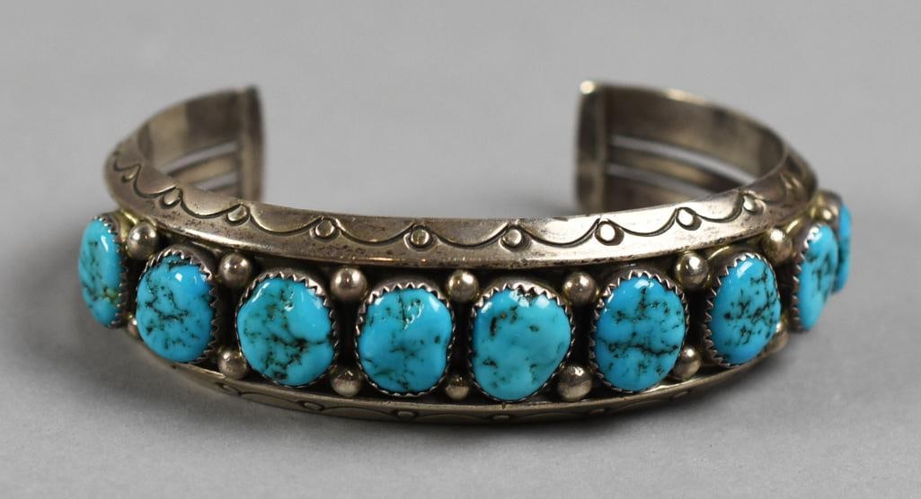 Sarah Curley Navajo Sterling & Turquoise Cuff Bracelet: Beautiful Native American bracelet by Navajo jewelry artist Sarah Curley. Sterling cuff bracelet with set turquoise with arches and circles. Stamped inside SC STERLING.