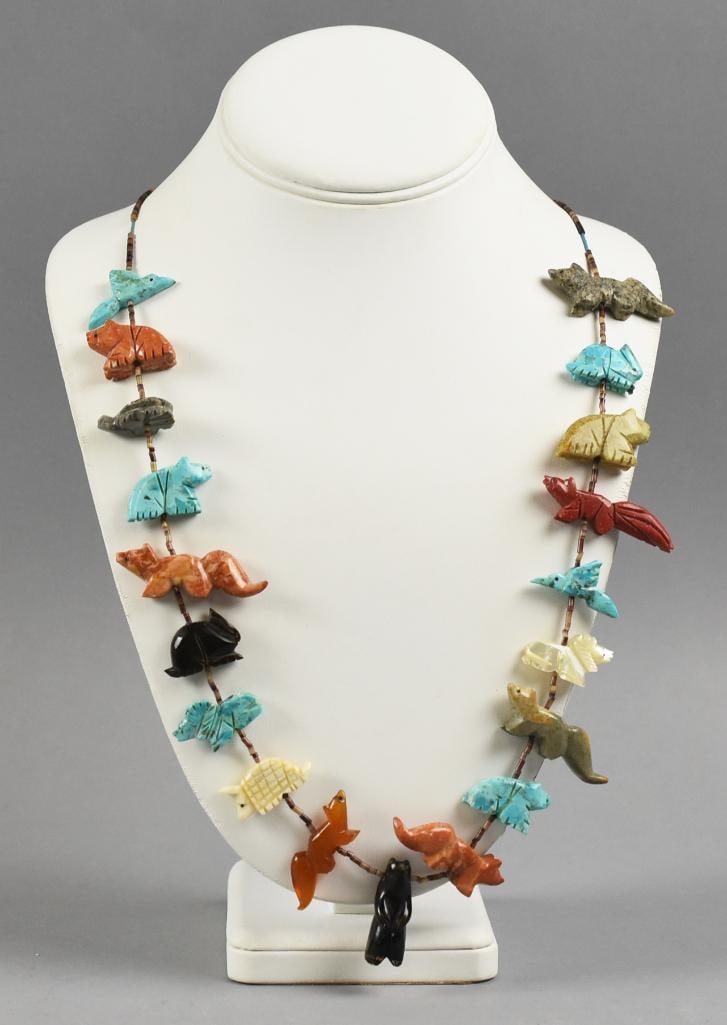 Vintage Zuni Fetish & Heishi Bead Necklace: Beautiful vintage Zuni fetish necklace that is approx. 29" long. There are a variety of animals that include bears, squirrels, rabbits and more, all with heishi bead accents. From the estate of a coll