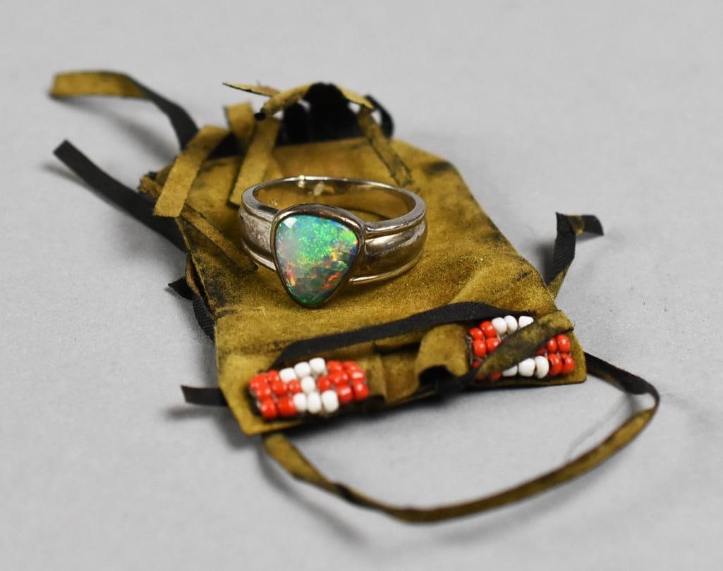 Vintage Native American Sterling & Opal Ring, Buckskin Pouch: This gorgeous ring is believed to be Native American. Sterling band with inset rounded corner cabochon opal. No visible artist mark, stamped 925. Comes in a Native American pouch that appears to be bu